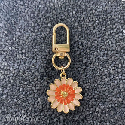 Blumenförmiger Schlüsselanhänger in Orange und Rosa